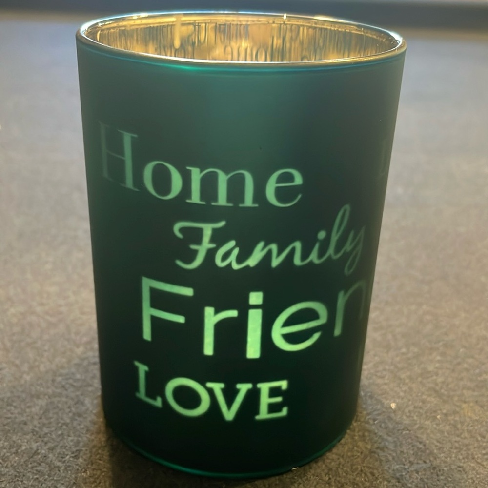 Flameless candle votive. Requires 2 AA batteries. Teal colored glass votive